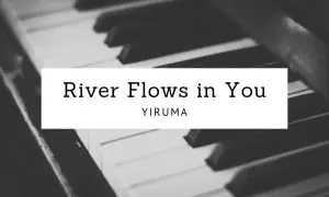 Nuty Yirumy "River Flows in You" na tle klawiatury fortepianu. Melodia płynie jak rzeka.