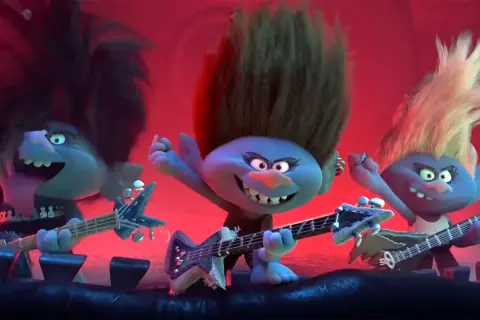 Trzy trolle rockmani grają na gitarach, tworząc energetyczne trolle piosenki.